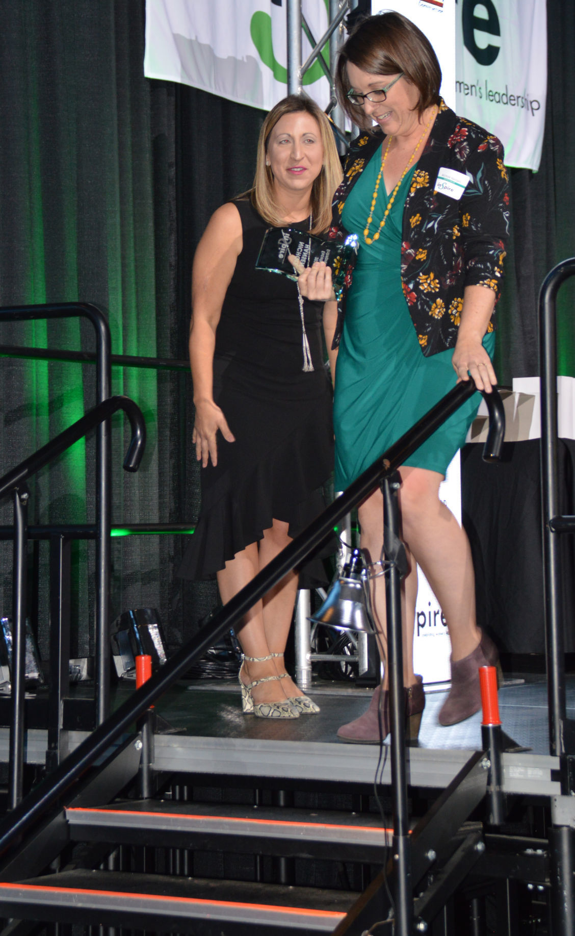 Nichole Hansen exits stage after receiving Entrepreneurship award from Natalie Wiita.JPG